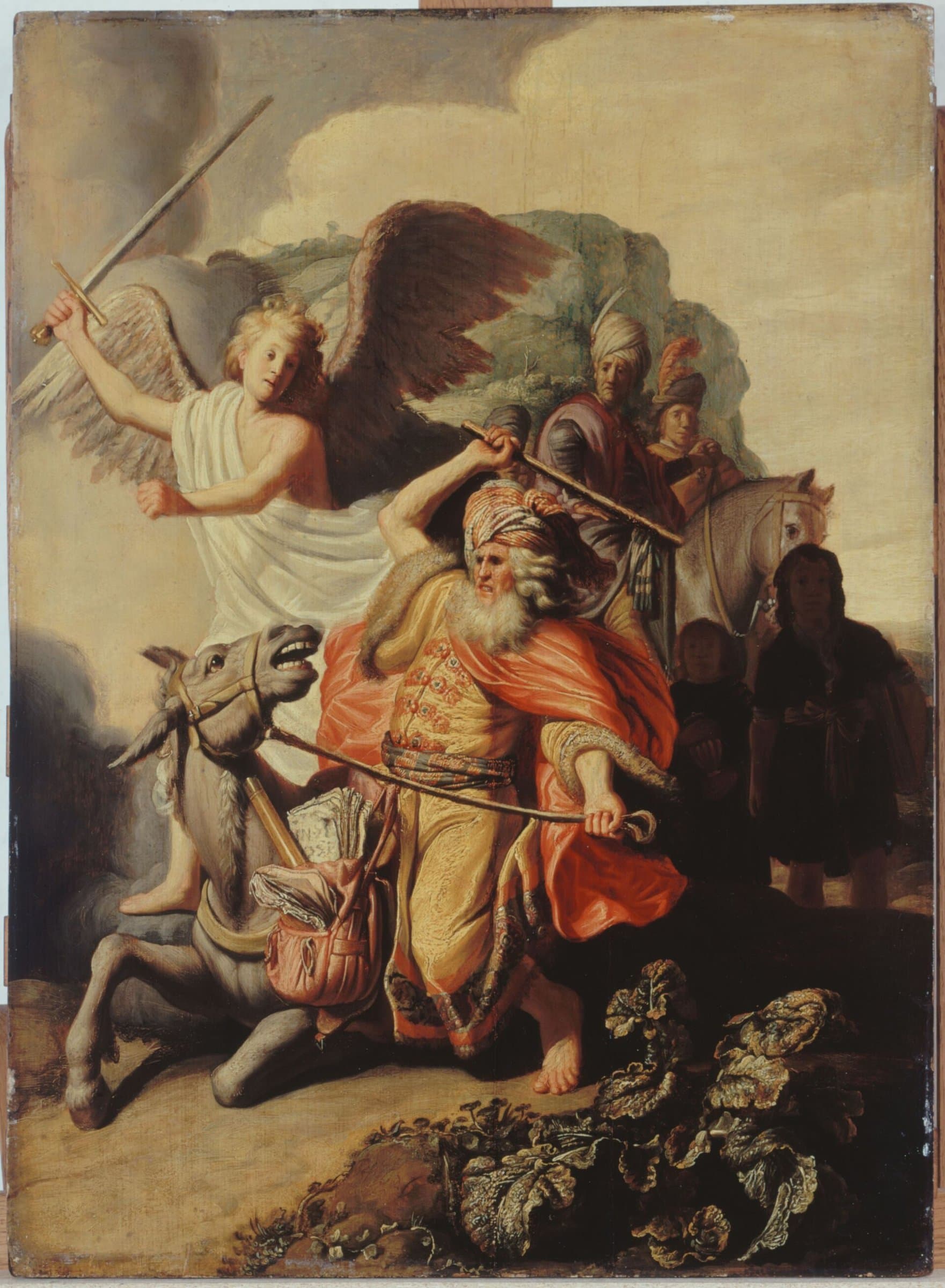 An angel in white with spread wings raises a sword over Balaam, who lifts his staff to strike the donkey as it sinks to its knees. Two riders and two servants stand behind him.