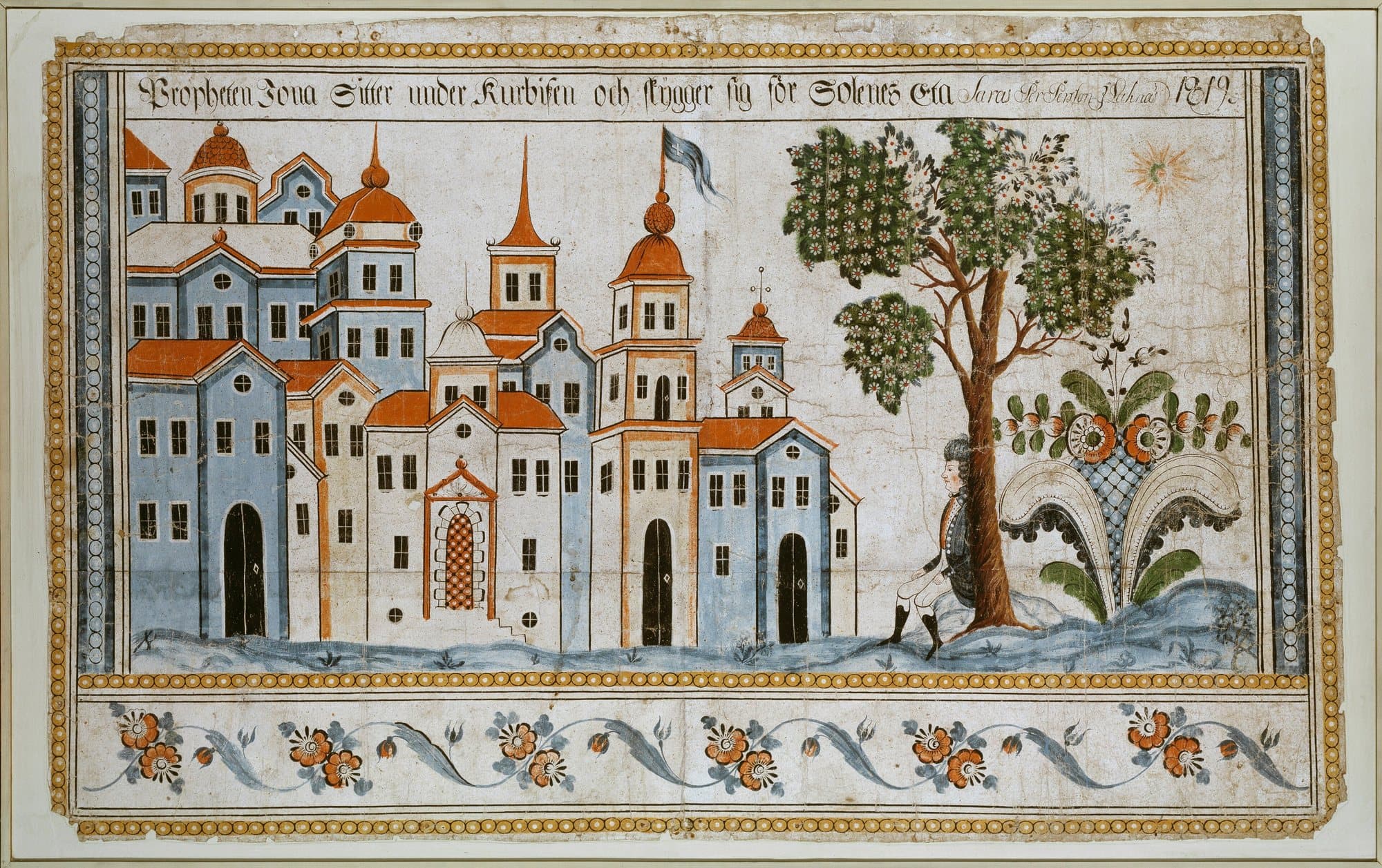 A man in a coat and boots sits against a flowering tree beside a city of blue and white towers, under a lettered border and a bright sun.