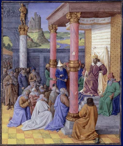A crowned king in a purple robe sits on a canopied throne between rose columns, and a crowd of bearded elders kneels and stands before him, with a castle on a hill and a river behind