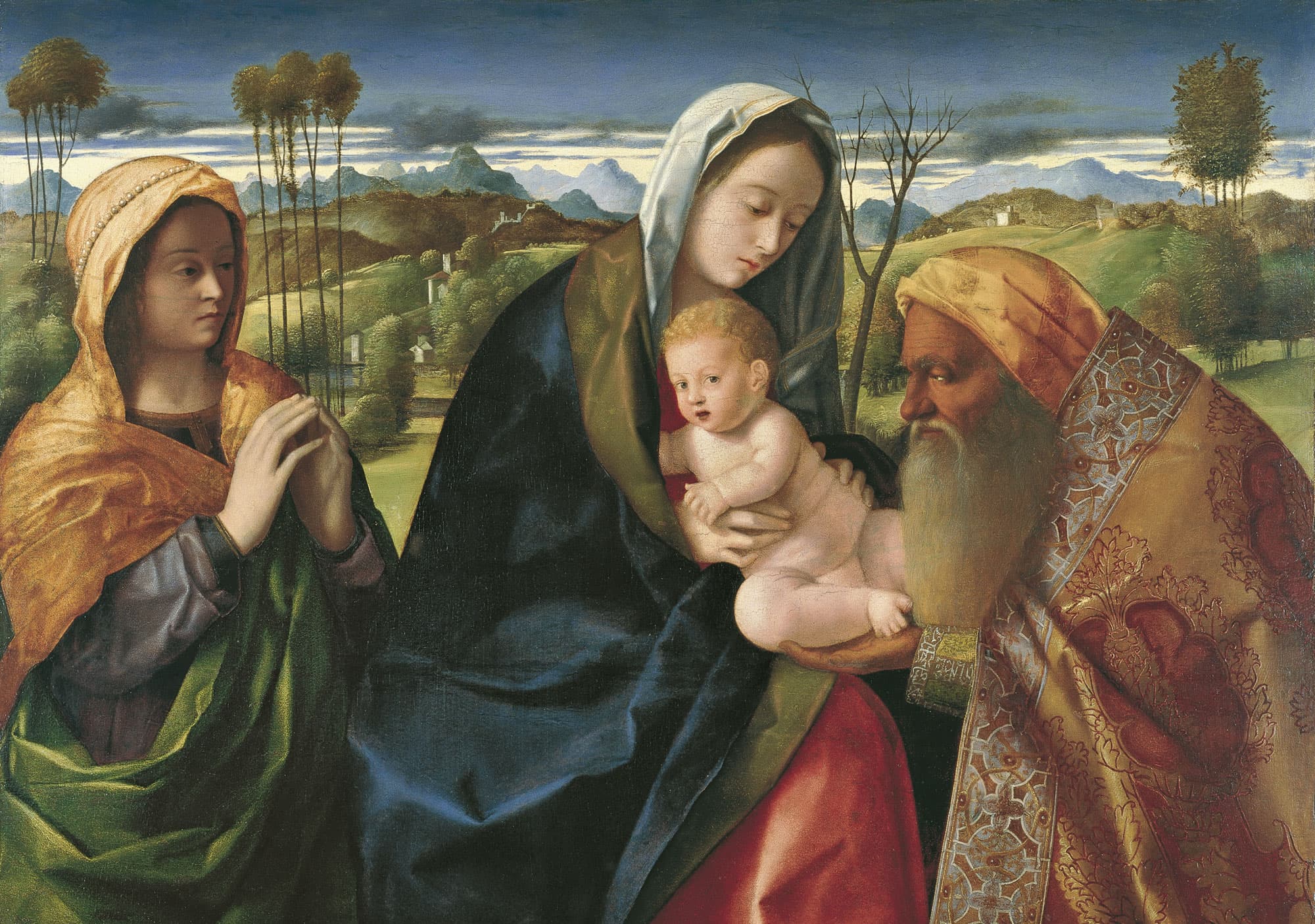 A painting of a bearded old man in a gold embroidered robe receiving a naked infant from his mother, who wears a dark blue mantle, while a young woman in an orange hood joins her hands in prayer, with green hills and mountains behind them.