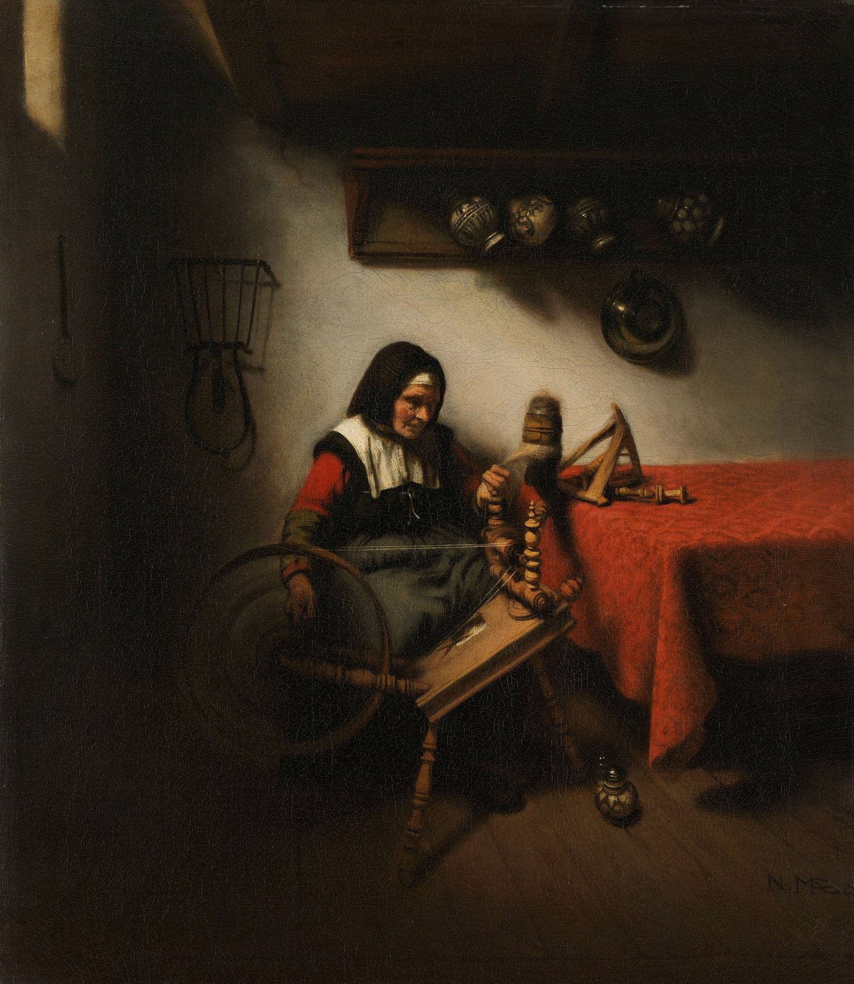 An old woman in a white collar and red sleeves sits at a spinning wheel in a dim room, drawing thread from the distaff beside a table under a red cloth.