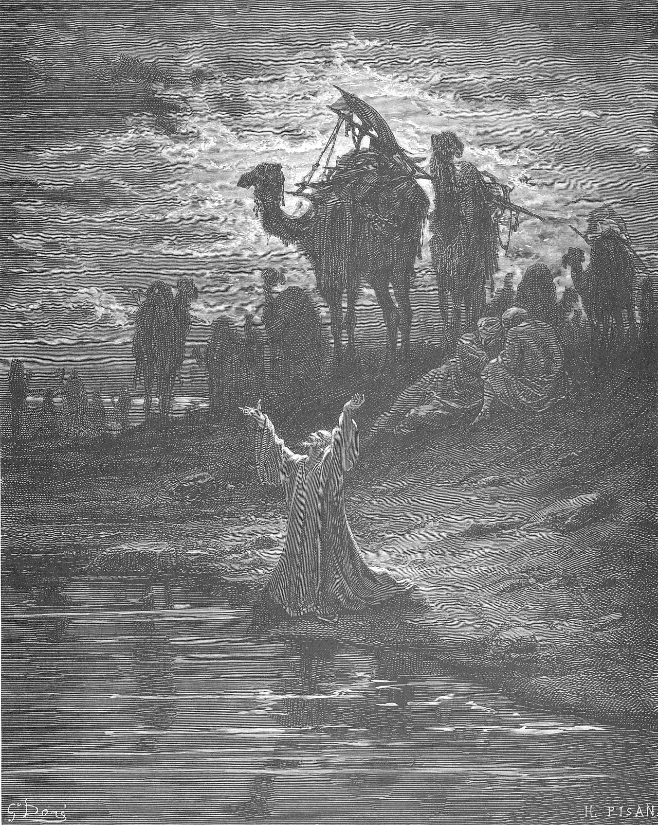At night beside dark water, an old man in a long robe kneels with both arms raised toward a clouded, moonlit sky. Behind him on a rise stand loaded camels, and a group of travellers sits huddled at the right.