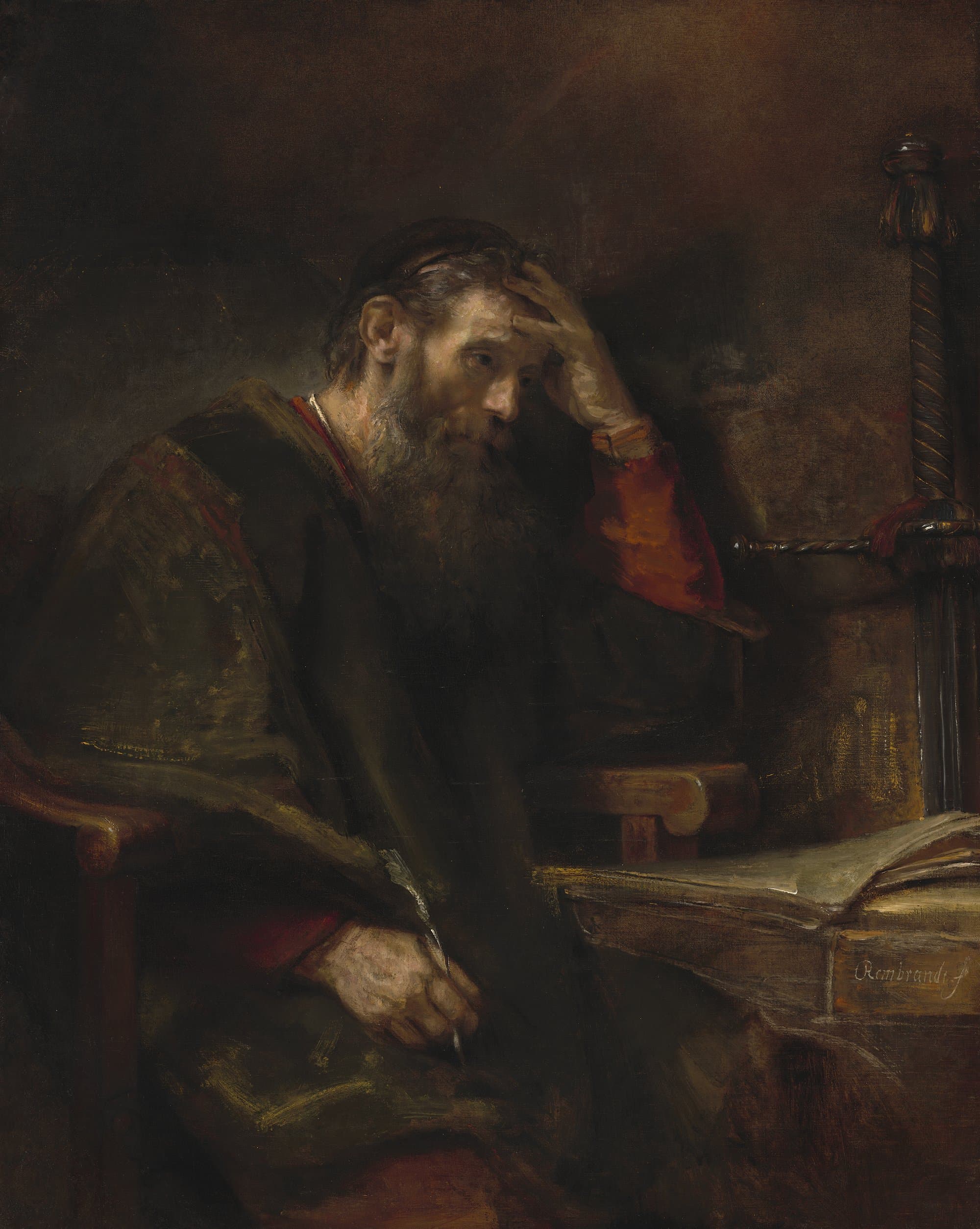 An old, bearded man in a dark robe sits at a table with an open book, his left hand pressed to his forehead and a pen in his right, while a sword with a twisted hilt leans against the wall behind the table.