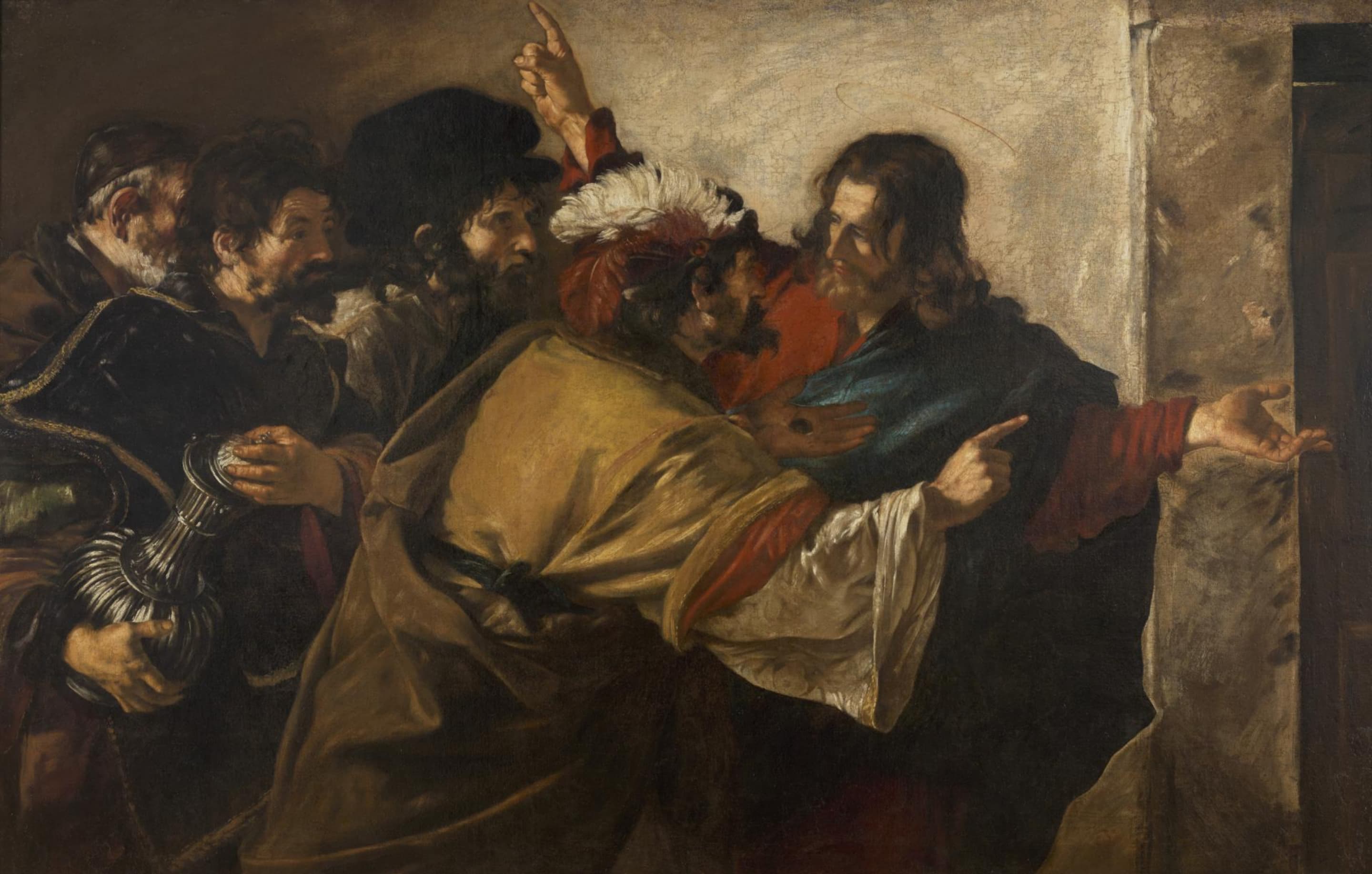 Jesus in a red robe and a blue cloak turns toward a crowd of bearded men pressing in from the left, one in a feathered cap leaning close to Him and one holding a silver jug; Jesus points upward with one hand and opens the other toward a doorway at the right.