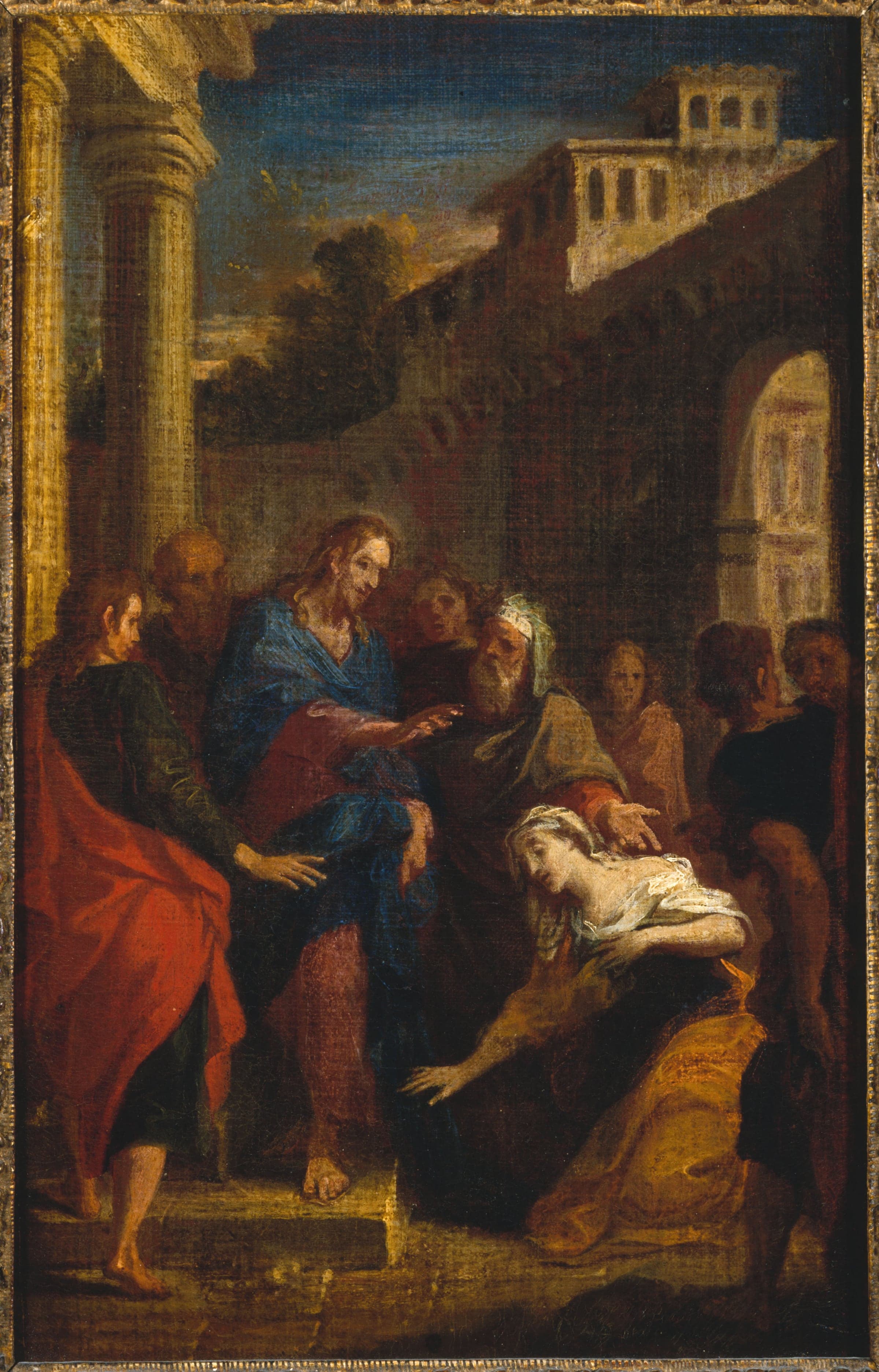 Before a colonnade and a city wall, Christ in a red robe and blue mantle turns and reaches out His hand toward a woman in a yellow dress who kneels at His feet with her hand stretched to the ground, while an old man in a turban points to her and disciples and a crowd look on.