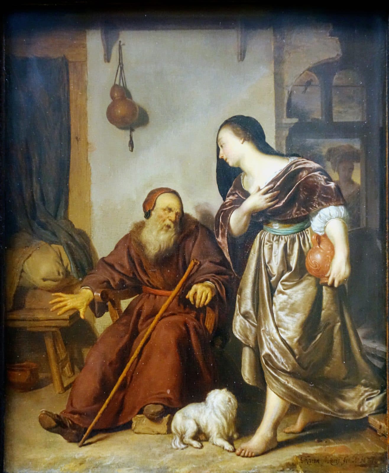 Mieris's painting of an old bearded man in a brown robe seated with a staff, one hand reaching out, as a young woman in a silk dress and dark veil stands before him holding a jar, with a small white dog at her feet