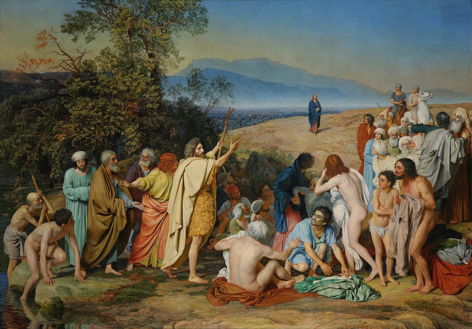 A crowd on the bank of the Jordan, some coming up from the river, as John the Baptist points to a lone robed figure walking toward them from the far hills