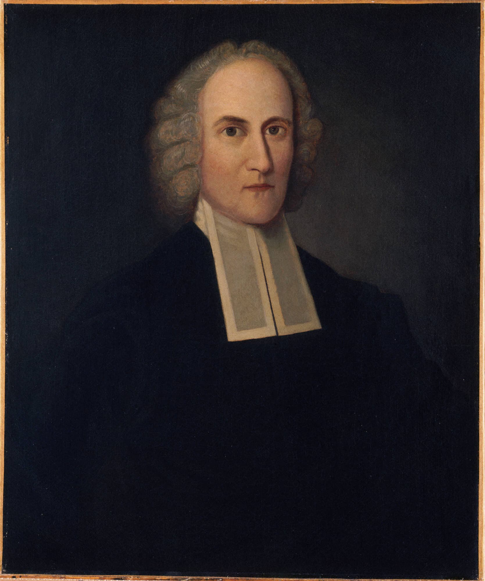 A painted half-length portrait of a pale, clean-shaven man with a long face and a grey curled wig, wearing a black gown and white preaching bands, set against a plain dark ground.