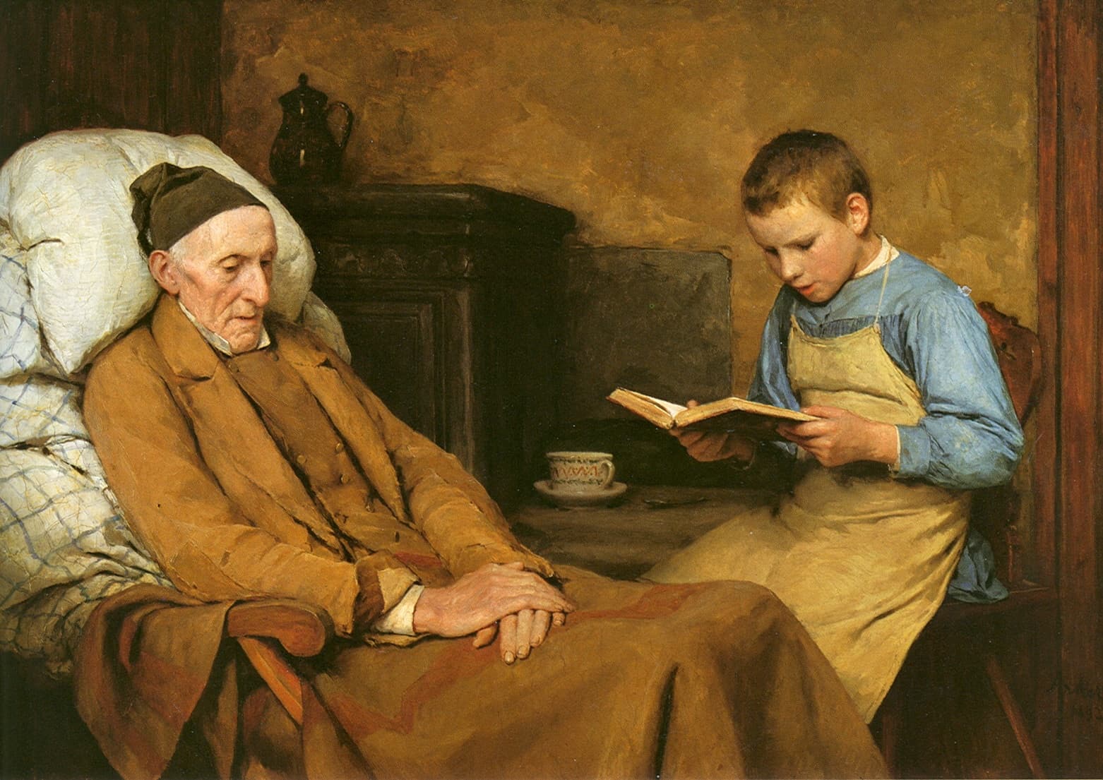 An old man in a dark cap and a brown coat rests in a chair against white pillows with his hands folded on a blanket, while a boy in a blue shirt and a yellow apron sits beside him and reads aloud from a small book. A cup and saucer stand on the table and a jug stands on the stove behind them.