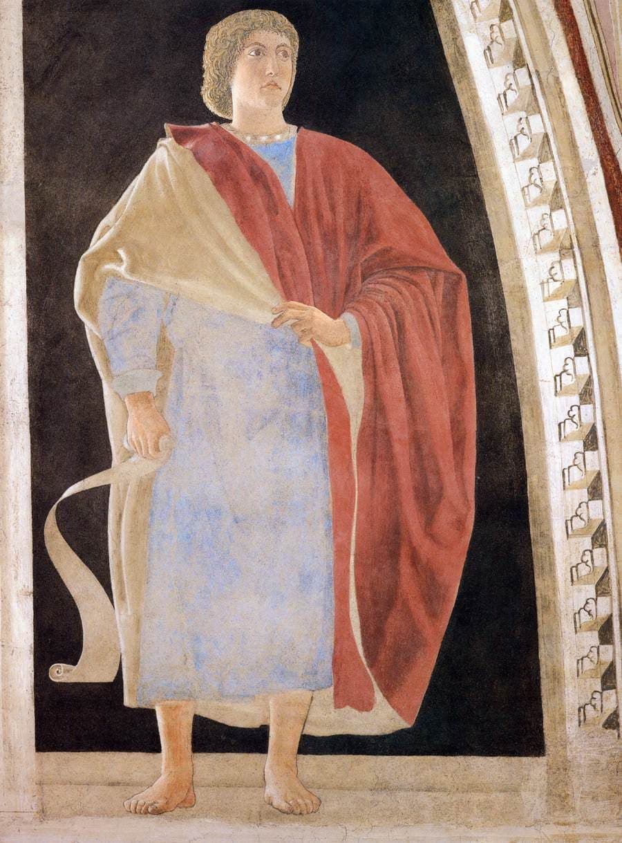 A fresco of a barefoot young man in a pale blue robe and a red cloak, holding an unrolled scroll at his side, standing in a painted niche beside a carved arch.