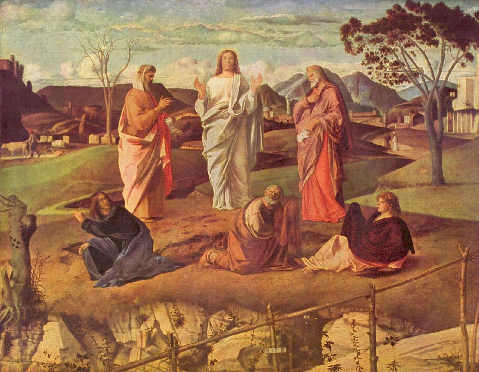 Christ in white stands on a grassy hilltop between Moses and Elijah, while Peter, James and John crouch on the ground below and a valley of farms and towns stretches behind