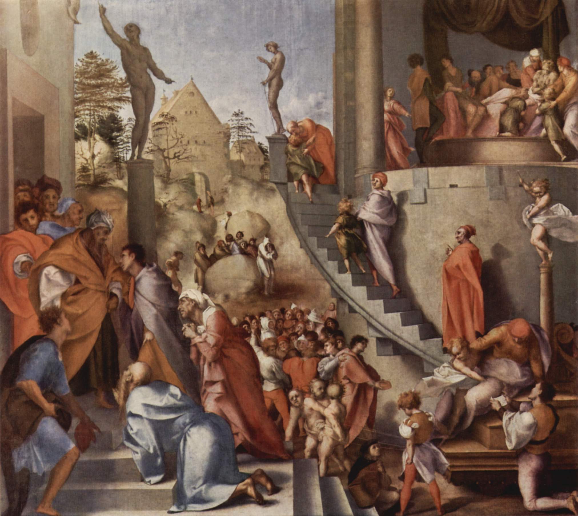 A crowded scene of several moments at once: on the left a young man in a lilac cloak presents an old man in a turban and orange robe to a kneeling crowd, a curved stone stair climbs past statues on pillars to a raised room on the right where an old man lies in bed surrounded by figures, and a young boy and a man in a lilac robe walk up the stair.