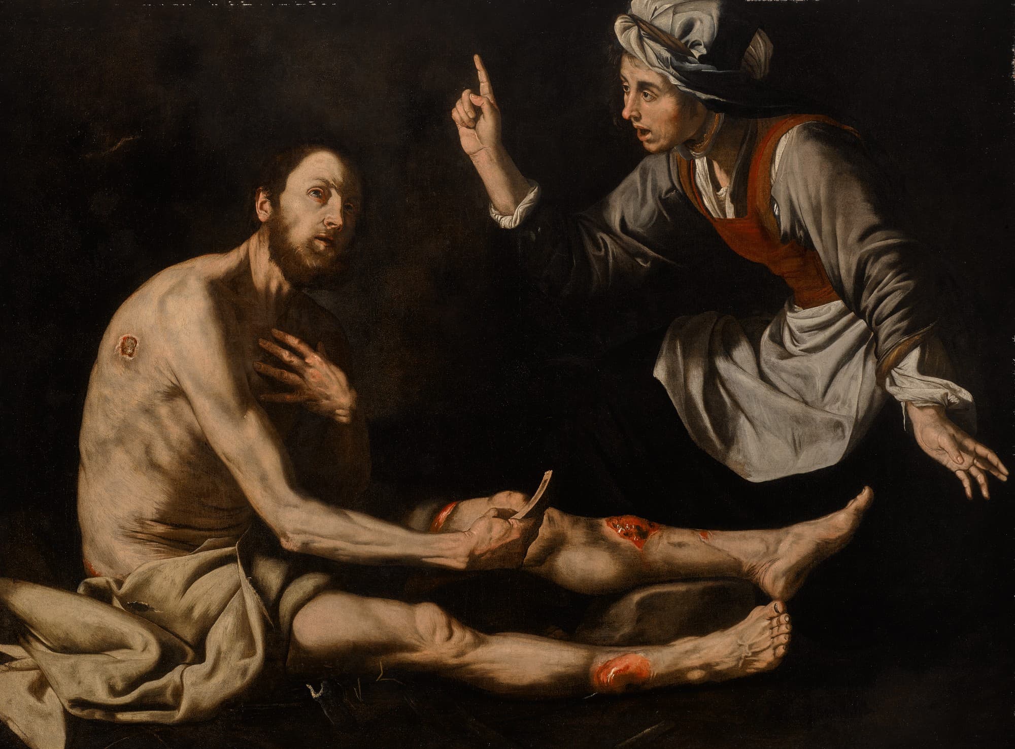 A thin, bearded man sits on the ground with sores on his shoulder and legs, scraping himself with a shard, while a woman in a white headcloth leans over him and raises her finger.
