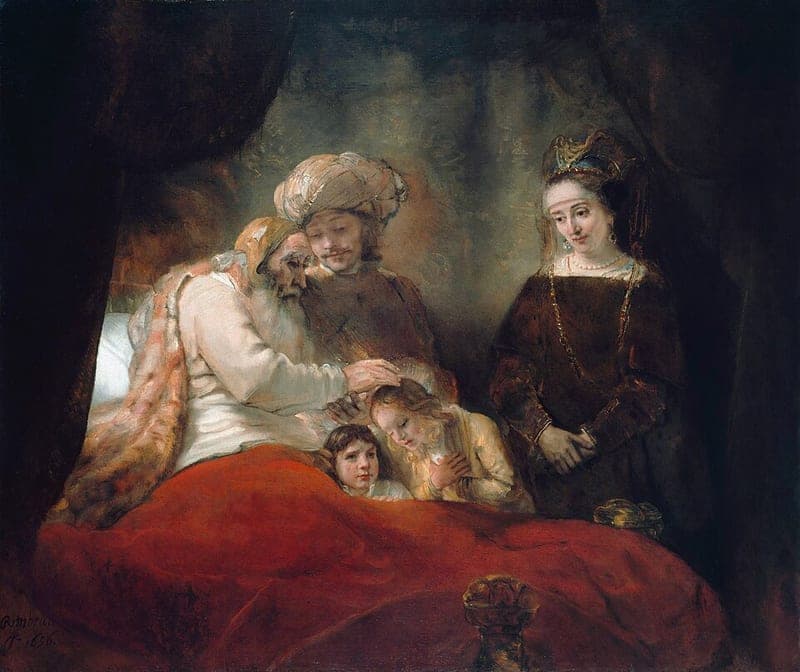 Rembrandt's painting of an old white-bearded man in bed under a red cover, laying his right hand on the head of a fair-haired boy whose arms are crossed on his chest, while a younger man in a turban leans over him and touches his hand, a dark-haired boy looks out beside the bed and a woman in a dark gown stands at the right
