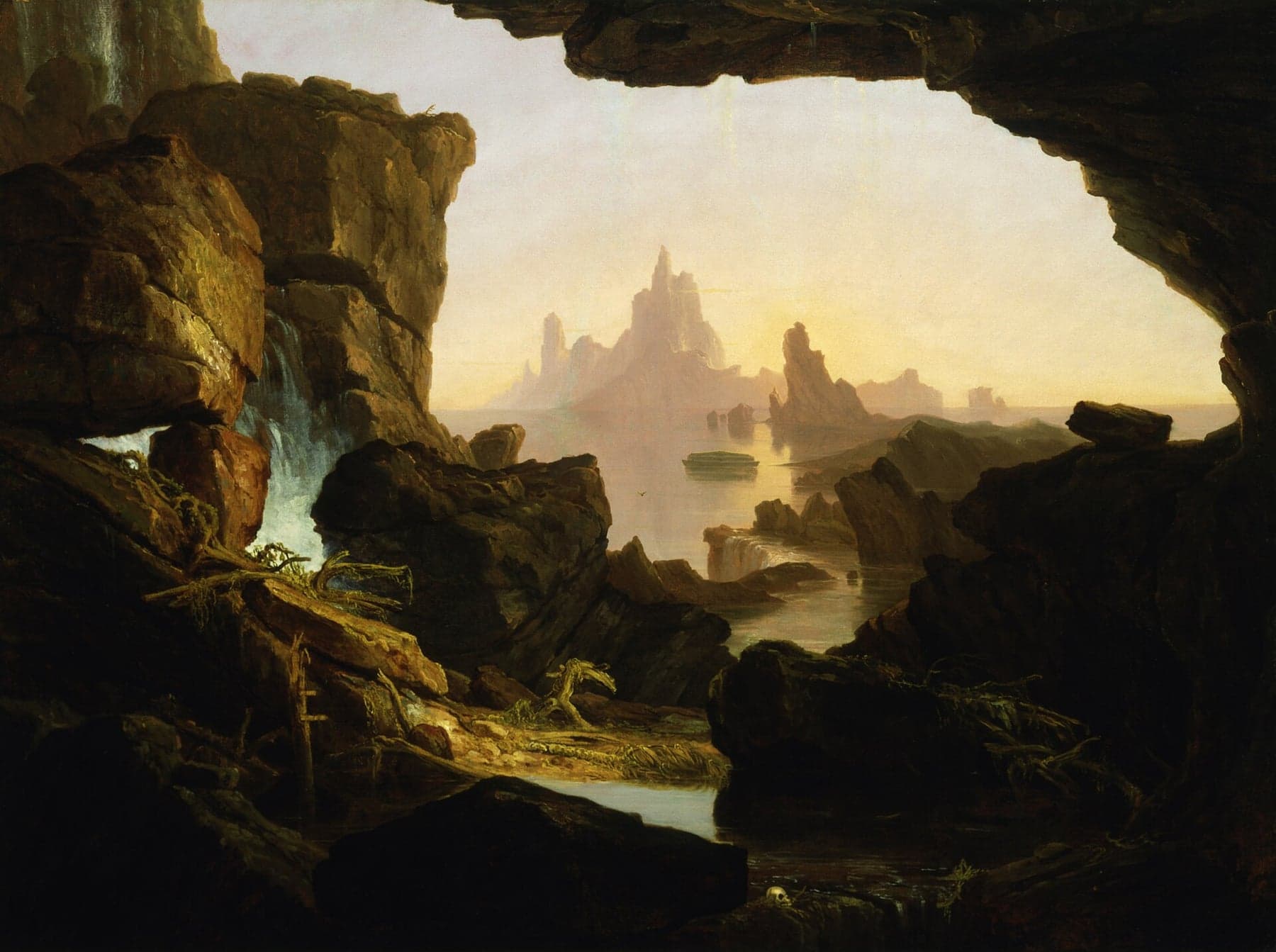 From inside a dark cave of wet rock, a calm sea opens toward pale peaks under a yellow dawn sky; a small boxlike ark floats on the still water near the center, a bird flies low beside it, water falls from the rocks at the left, and a skull lies among roots and debris in the foreground