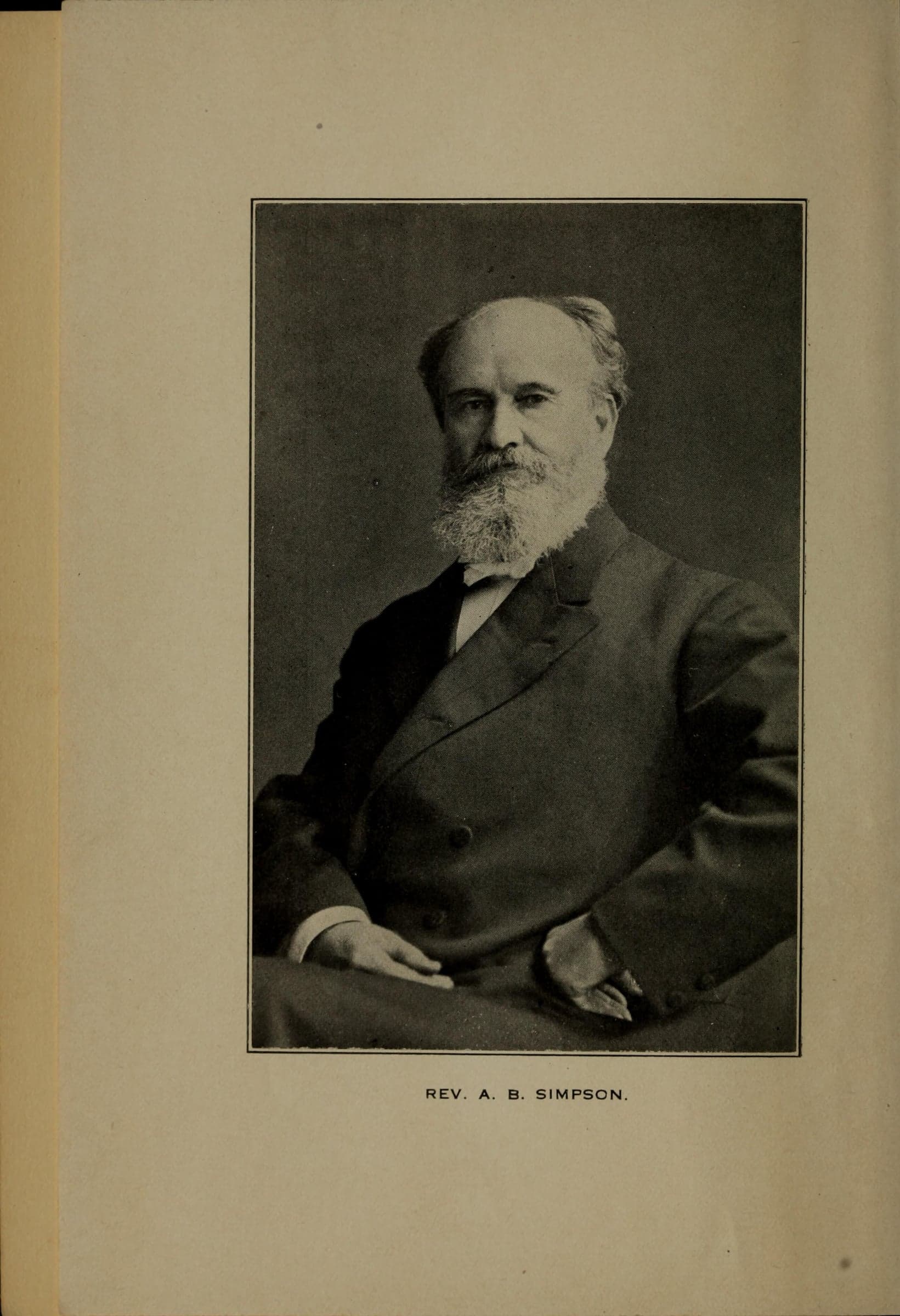A photograph of an older bearded man in a dark suit, seated with one hand on his knee, printed on a book page over the caption Rev. A. B. Simpson.