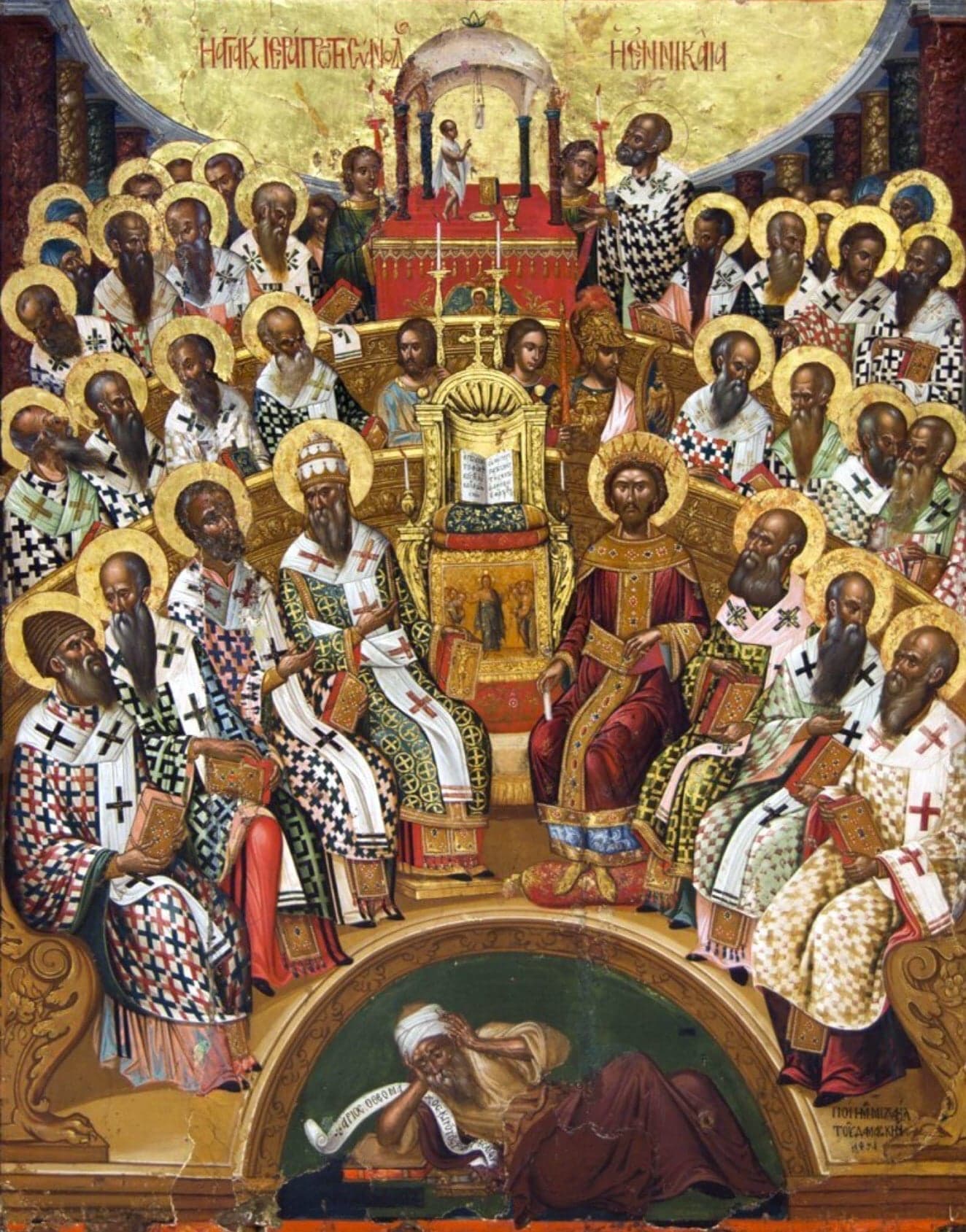 Bishops with haloes and white robes sit in curved rows round a crowned emperor and an open book on a throne, under a domed canopy, with a man lying in the arch beneath them.