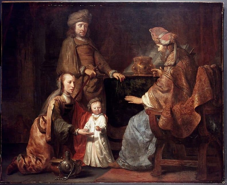 A woman in a brown and gold dress kneels and holds out her hands to a small child in white, who steps toward an old priest in a turban and patterned robe seated in a carved chair at the right; a man in a turban stands behind them beside a table with a golden vessel, and a metal jug stands by her knee.