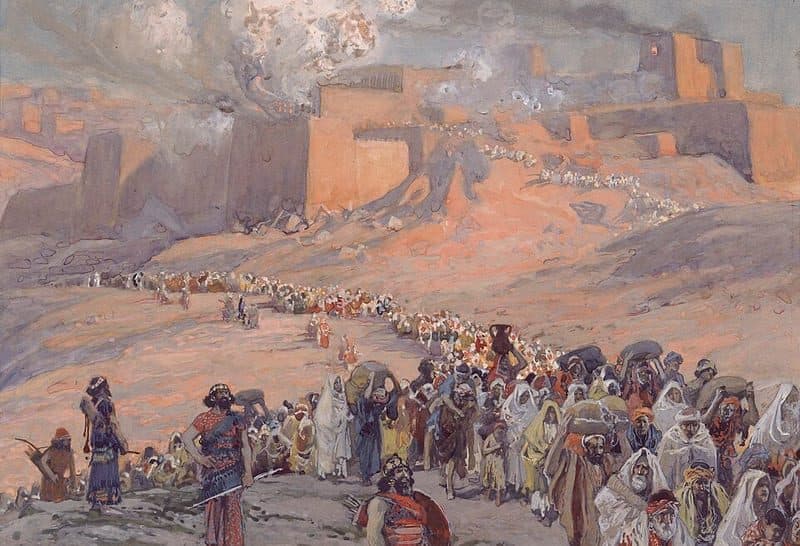 A long line of captives carrying bundles winds down a bare hillside away from a walled city, while smoke rises over its towers and armed men watch them go.