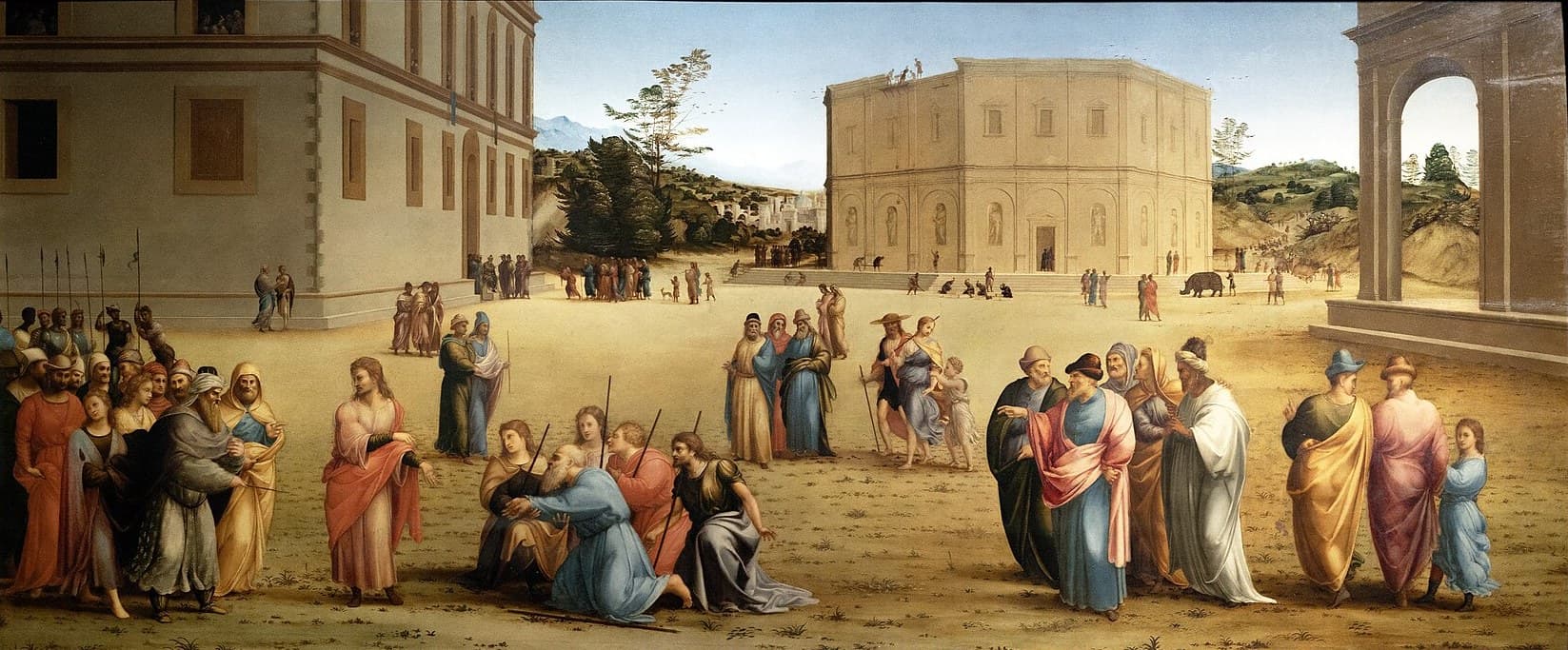 In a wide sunlit square between two palaces, a young man in a red cloak stands beside a crowd of courtiers and spearmen, while an old man in blue kneels in the middle of the square as younger men with staffs embrace him, and bearded men in long robes stand in groups to the right
