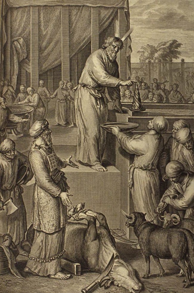 Moses stands barefoot on the altar step and puts blood on a horn of the altar from a bowl a man holds up to him, while Aaron in his breastpiece stands below beside the slain bull, men lead two rams forward, and a crowd watches from beyond the curtains of the court.