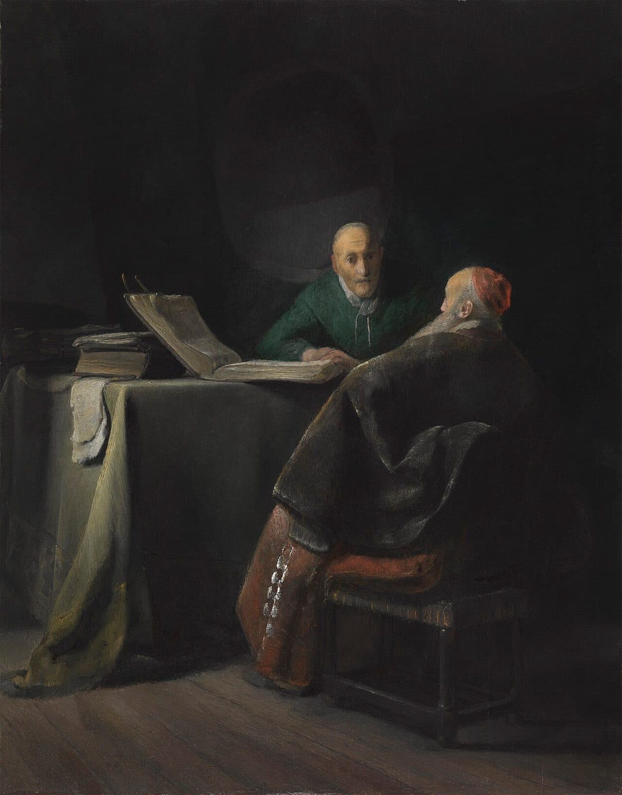 Two old men sit at a table in a dark study, one in green facing out with his hand on a large open book, the other turned away in a fur-lined cloak and a red cap