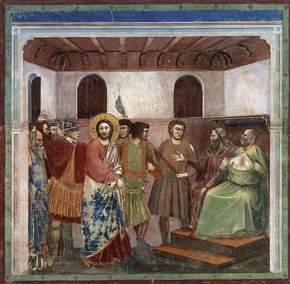 A fresco of Christ, haloed and bound among soldiers in a hall, while the seated high priest tears open the front of his green robe.