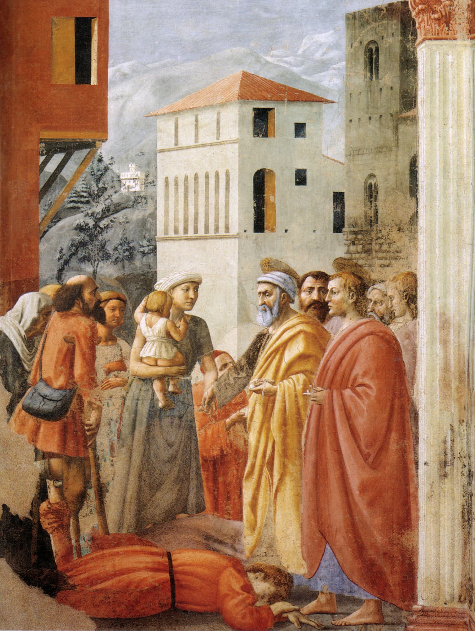 An old apostle with a white beard in a yellow cloak places a coin in the hand of a young mother holding a small child, beside a young apostle in a red cloak and other men with haloes, while a man on a crutch and other poor people wait and a man lies dead on the ground at their feet, in a town street with a white house and mountains behind.