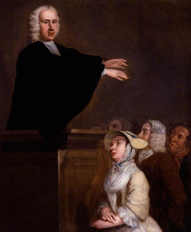 A painting of a young preacher in a black gown and a white wig standing in a pulpit with both arms stretched out, while a young woman in a straw bonnet and two men below him look up as they listen.
