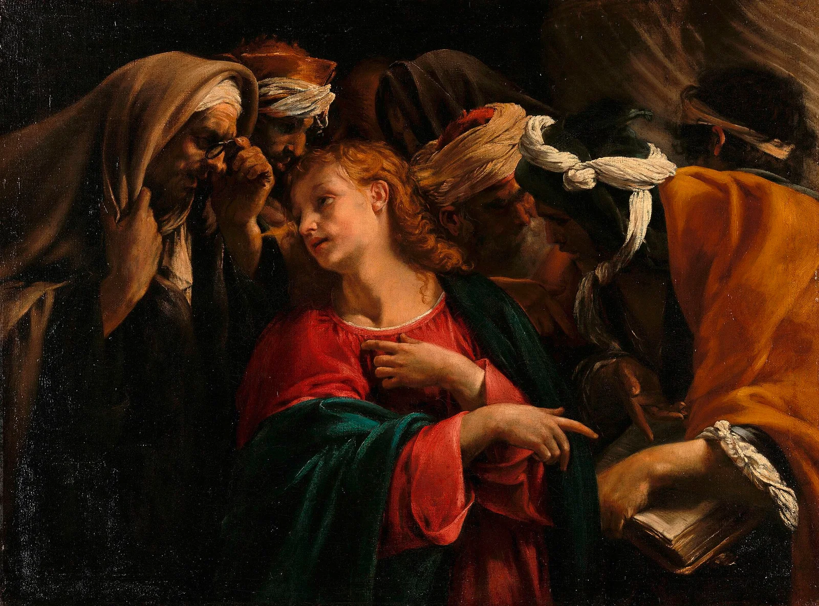 The boy Jesus in a red robe and a green cloak sits among bearded teachers in turbans who press close around Him, one holding a book, as He points while He speaks.