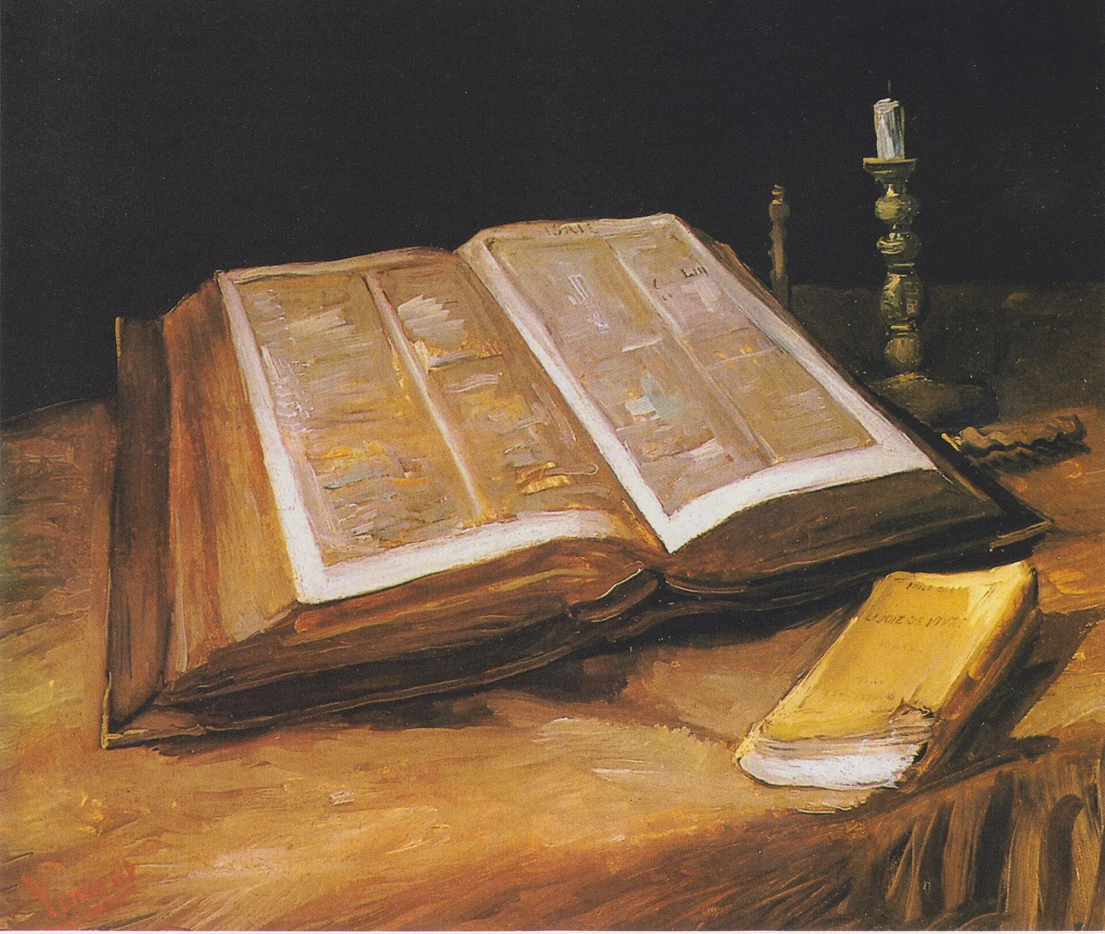 A large open Bible lies on a table beside a snuffed candle in a brass holder and a small closed yellow book.