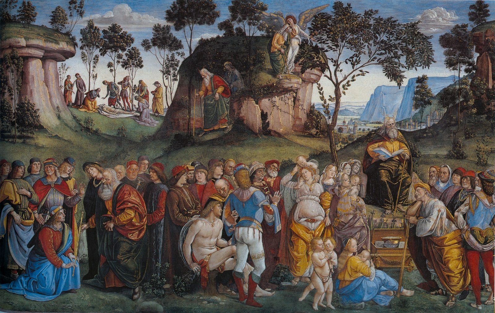 Moses sits on a rise and reads from an open book to a crowd, a gilded chest at his feet; above, an angel shows him the land, and mourners gather at the upper left.